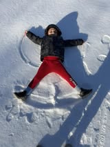 Chelo-Alvarez-little-one-making-snow-angels