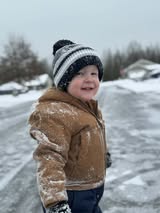 Edie-Hutchison-happy-toddler-in-Carhart-jacket