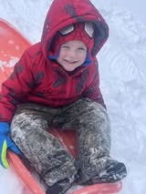 Kelsey-Farris-little-boy-on-sled