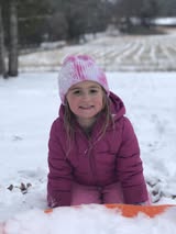Lindsay-Box-happy-little-girl-on-sled